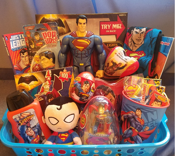 superman gifts in a blue plastic basket