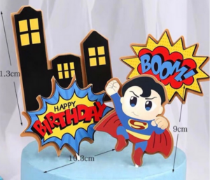a cake and a doll showing 3D Superman Gift toppers